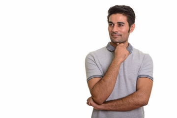 Young handsome Persian man against white background