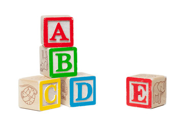 Wooden alphabet blocks isolated on white background