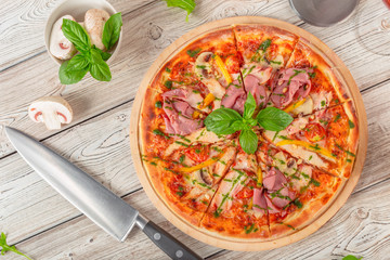 Delicious fresh pizza served on wooden table