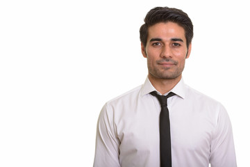 Young handsome Persian man against white background