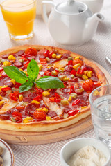 Delicious fresh pizza served on wooden table