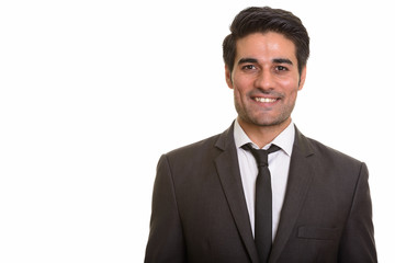 Young handsome Persian man against white background