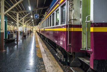 Obraz premium Old Thai train at Bangkok station, most of Thai train run by diesel engine. In vintage styles of travel in Thailand, journey with train is a one of popular. Many tourists plan to travel in this style.