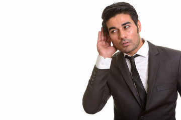Young handsome Persian man against white background