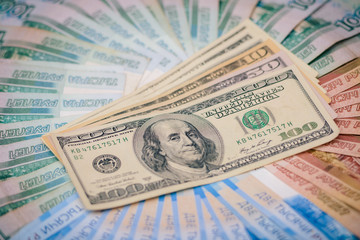 Us banknotes with a portrait of Franklin are on banknotes of different denominations of the Russian Federation. The concept of currency exchange, trade, market.