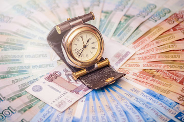 Watches are on banknotes of different denominations of the Russian Federation. The concept of time is money.