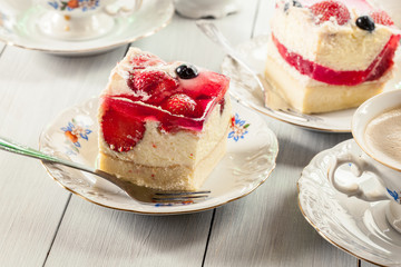 Cheesecake with strawberries, blueberry and jelly