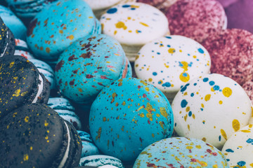 A lot of colorful macaroons on the candy shop.