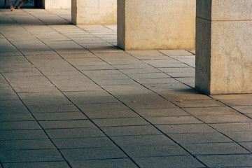 white square columns in a city park.