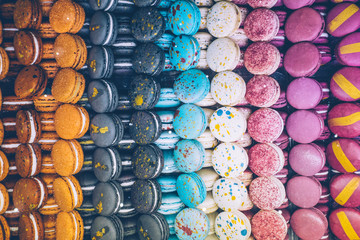 A lot of colorful macaroons on the candy shop.