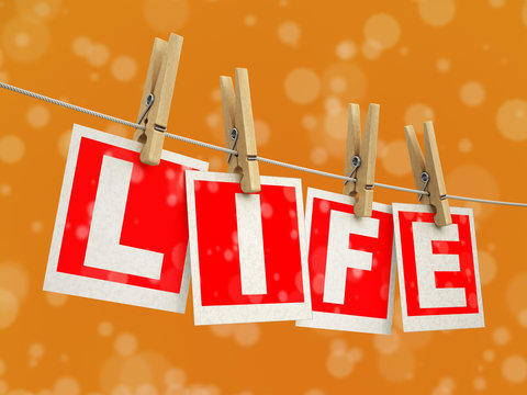 Wooden clothespins on rope with Life. Image with clipping path