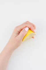 Woman hand with lemon