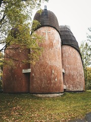 Plakat Stone brick church of the evangelists, built a strange shape, unusual church, autumn leaves everywhere