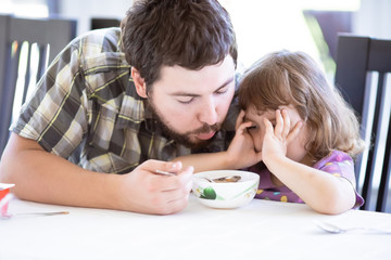 Cute little girl doesn’t want to eat. Kid refusing food. Sad child.