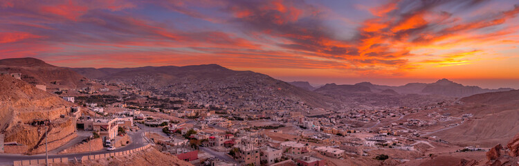 Wadi Musa, city of Petra in Jordan. Beautiful sunset over Wadi Musa, town located in Ma'an...