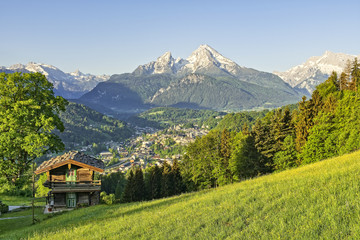 Fototapeta premium Mountain landscape in the Bavarian Alps with village of Berchtesgaden and Watzmann in the background Berchtesgadener Land, Bavaria, Germany