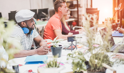 Multiracial co-workers team talking during startup