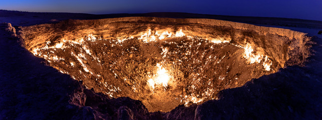 Turkmenistan gates of hell gas crater fire in Karakum desert near Darvaza. Burning methane gas crater in Derweze in Karakum desert. Door to hell in Turkmenistan. - obrazy, fototapety, plakaty