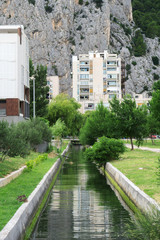 Water canal flowing thru the Omis city in Croatia.