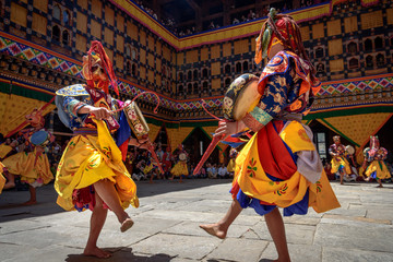 Bhutan Monk dancing for colorful mask dance at yearly Paro Tsechu festival in Bhutan - obrazy, fototapety, plakaty