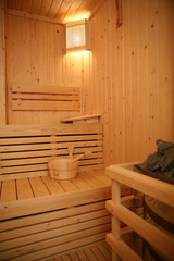 Fototapeta na wymiar Wooden sauna cabin with sauna accessories
