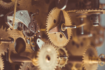 Vintage gears and cogs in mechanism macro retro toned