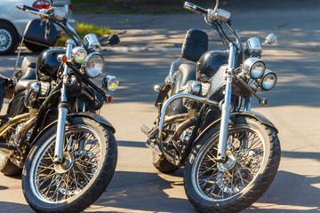 Obraz na płótnie Canvas Two motorcycles parked on city street