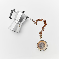 A cup of coffee, metal coffee maker and coffee beans in the shape of a question mark on a gray background with space for text. Flat lay