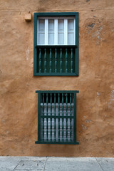 Fototapeta na wymiar Windows in the Old City portion of Cartagena, Colombia, known for its colorful Spanish colonial architecture