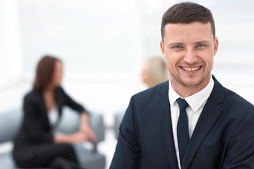 successful businessman on blurred background office