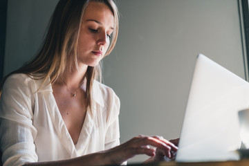 young woman working on laptop