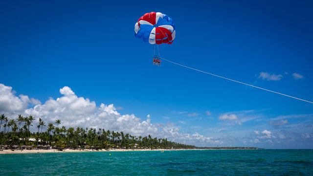 parasailing on a beautiful beach in the caribbean sea 