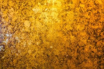 Gold and back abstract background with color shift from light to dark.