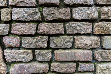 Granite masonry, rough gray stone wall, background