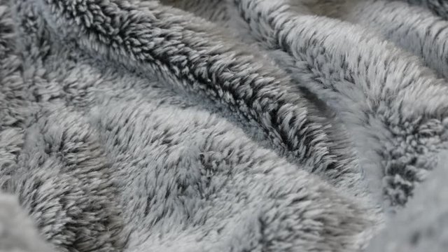 Dark gray hairy artificial fur fabrics 4K  panning video