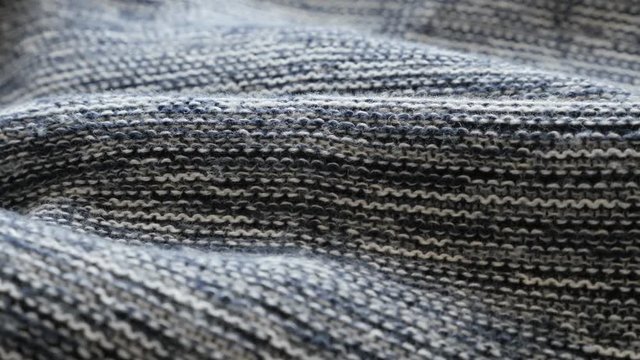 Stockinette stitch on knitted fabric close-up 4K panning video