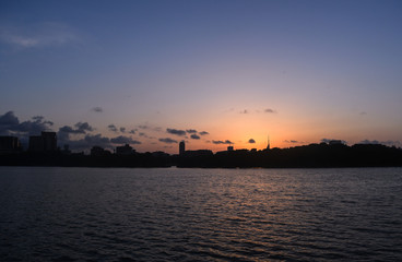 Cityline sunset over water, Ohori park, Fukuoka, Japan