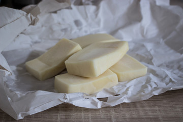 Pieces of cheese Eidam isolated on white background