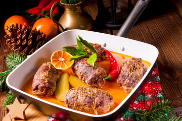 Wintry beef roulades with plum and bacon stuffing and cucumber