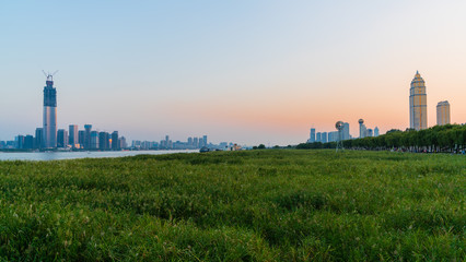 Fototapeta premium Panorama of Wuhan cityscape at sunset with Wuchang and Hankou districst skyline and both side of Yangtze in Wuhan Hubei China
