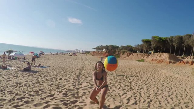 Father Plays Beach Volleyball With His Daughter. Shooting From The First Person.