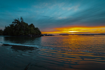 Fototapeta na wymiar Sunset during Blue hour at MacKenzie Beach in Tofino on Vancouver Island, British Columbia, Canada