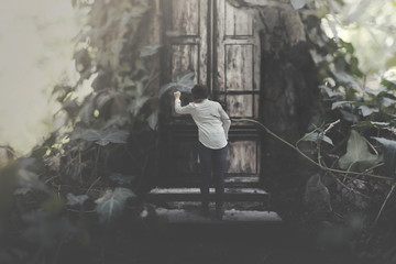 traveling woman looking for shelter in a tree house in a surreal forest