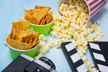 scattered popcorn and two buckets of nachos, next to the video camera and take to stop and continue...