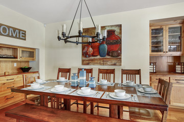 White spacious dining area with built in cabinets