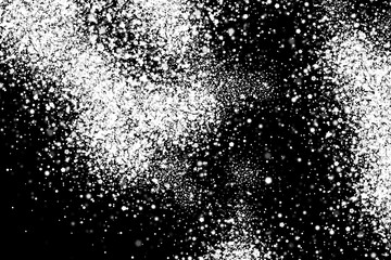 Snow explosion. Abstract grainy white texture isolated on black background. Overlay element for design