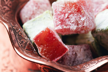 Turkish delight (lokum) in traditional oriental carved patterned metal plate