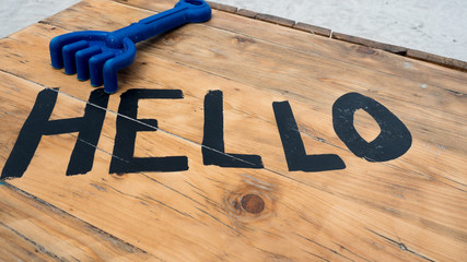 letter hello on wood table