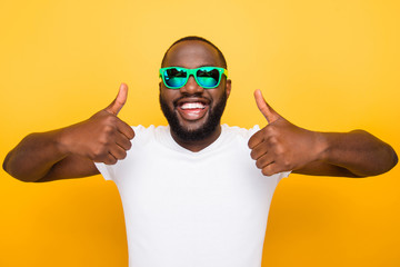 Portrait of cheerful nice glad satisfied mulato man in color gre