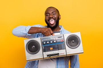 Portrait of handsome funky cheerful positive nice mulato man in 